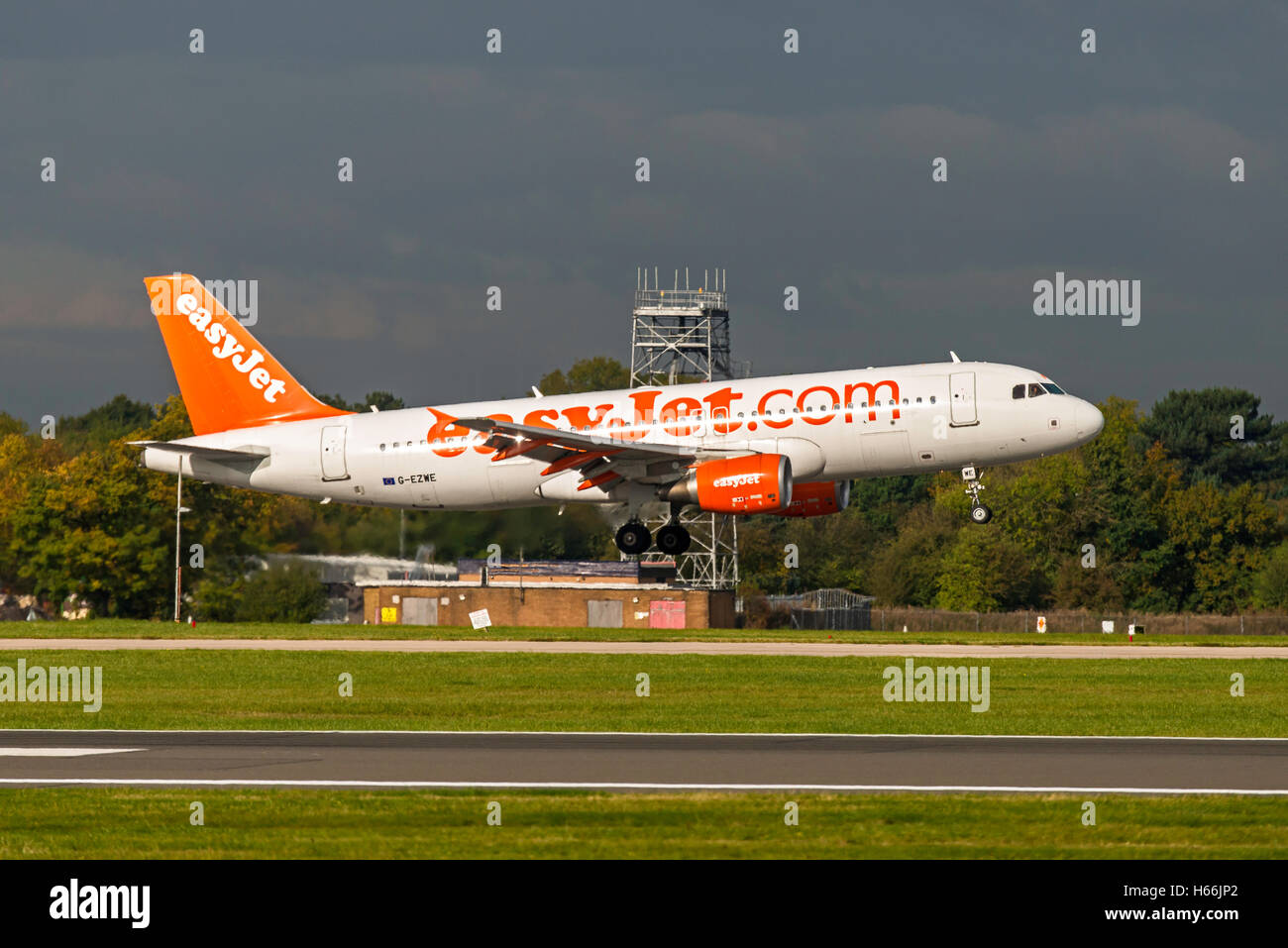 A320-214, EasyJet, D-AXAL, G-EZWE Landing Manchester Airport England.Uk Arrivals Stock Photo