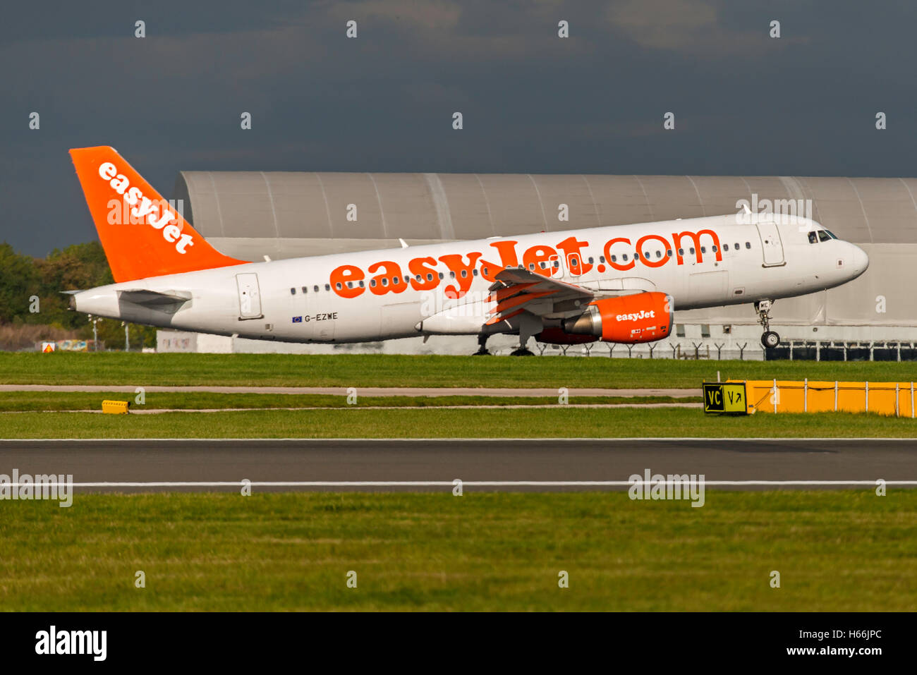 A320-214, EasyJet, D-AXAL, G-EZWE Landing Manchester Airport England.Uk Arrivals Stock Photo