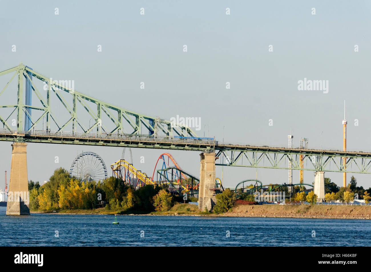 La Ronde amusement park on St. Helen's Island, Pont Jacques Cartier bridge and St. Lawrence River, Montreal, Quebec, Canada Stock Photo