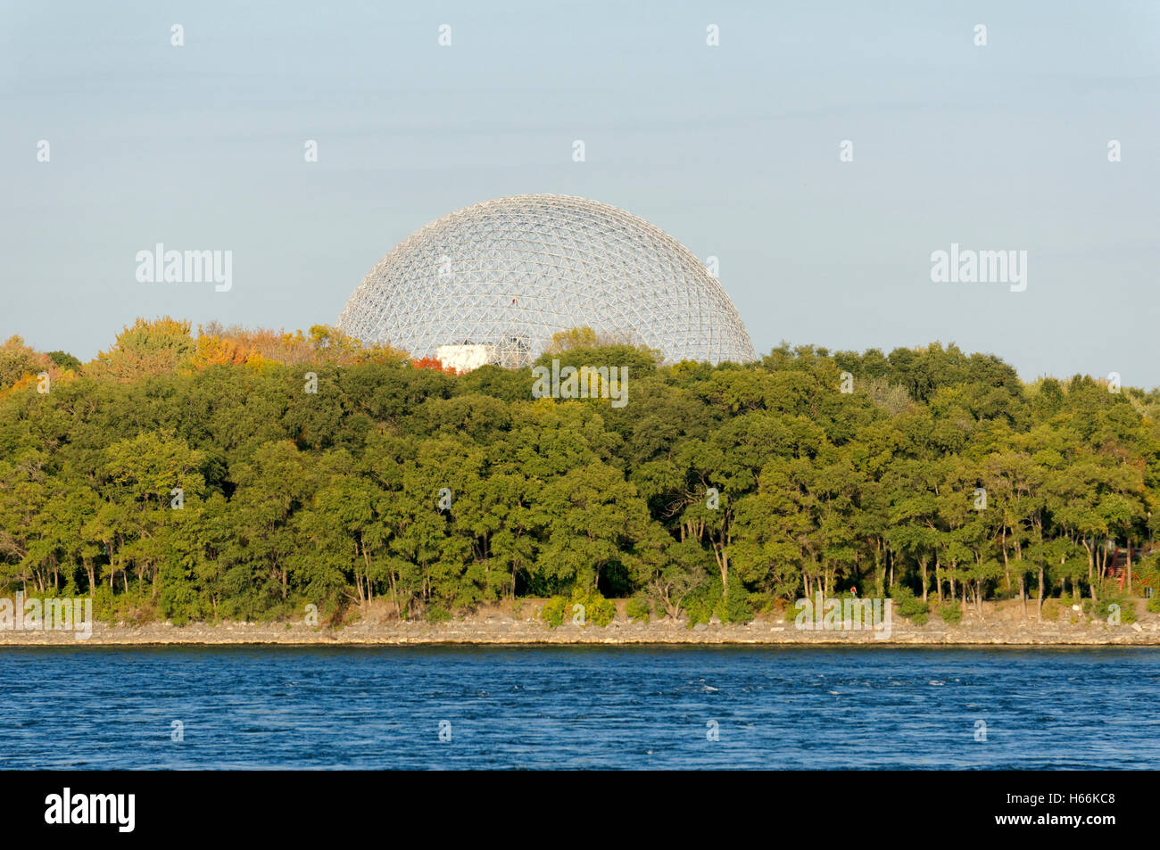 The Montreal Biosphere in Parc Jean-Drapeau on Saint Helen's Island, St. Lawrence River in foreground, Montreal, Quebec, Canada Stock Photo