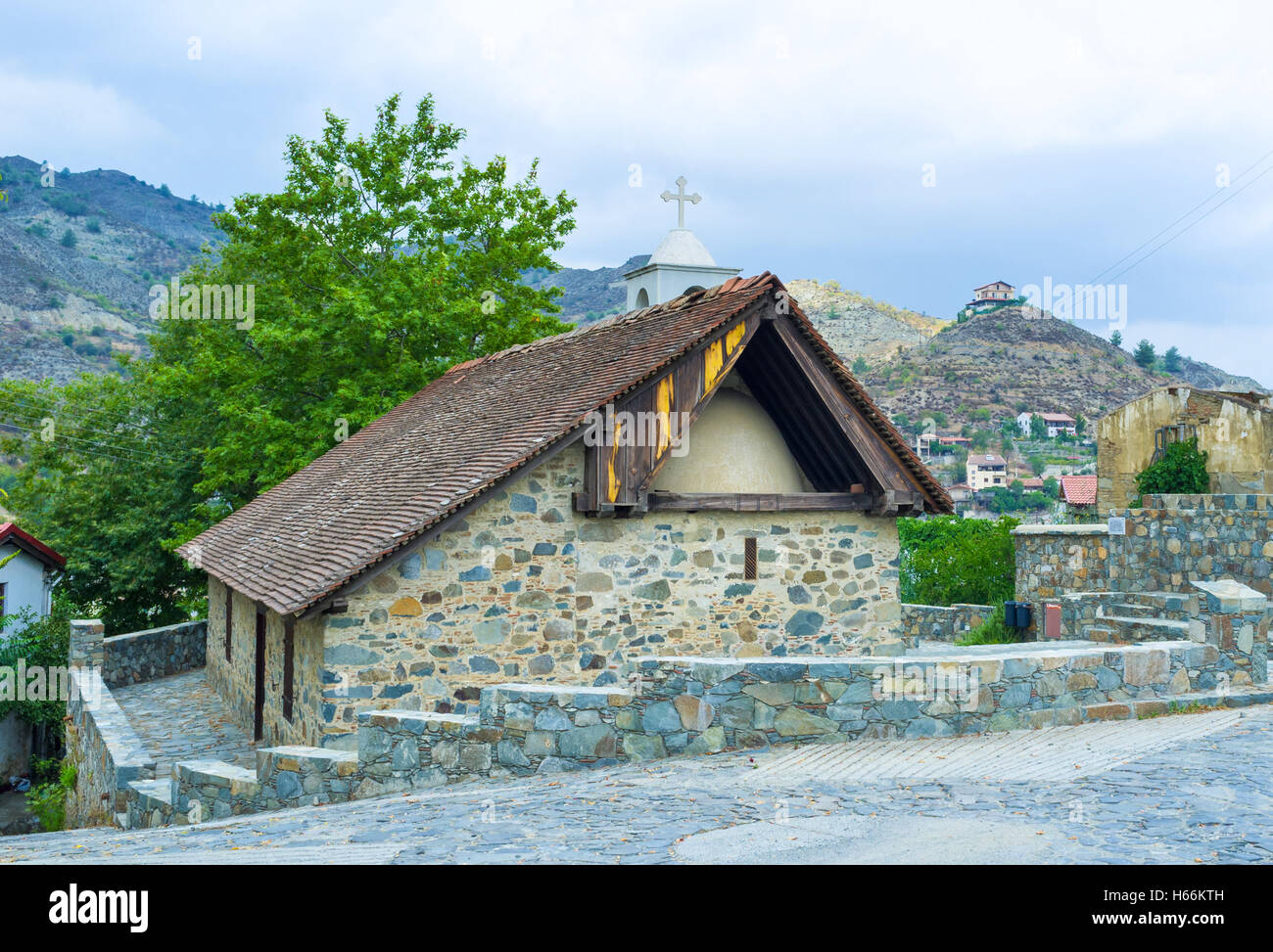 The old church in the mountain village, its dome covered with the tiled roof, Farmakas, Cyprus. Stock Photo