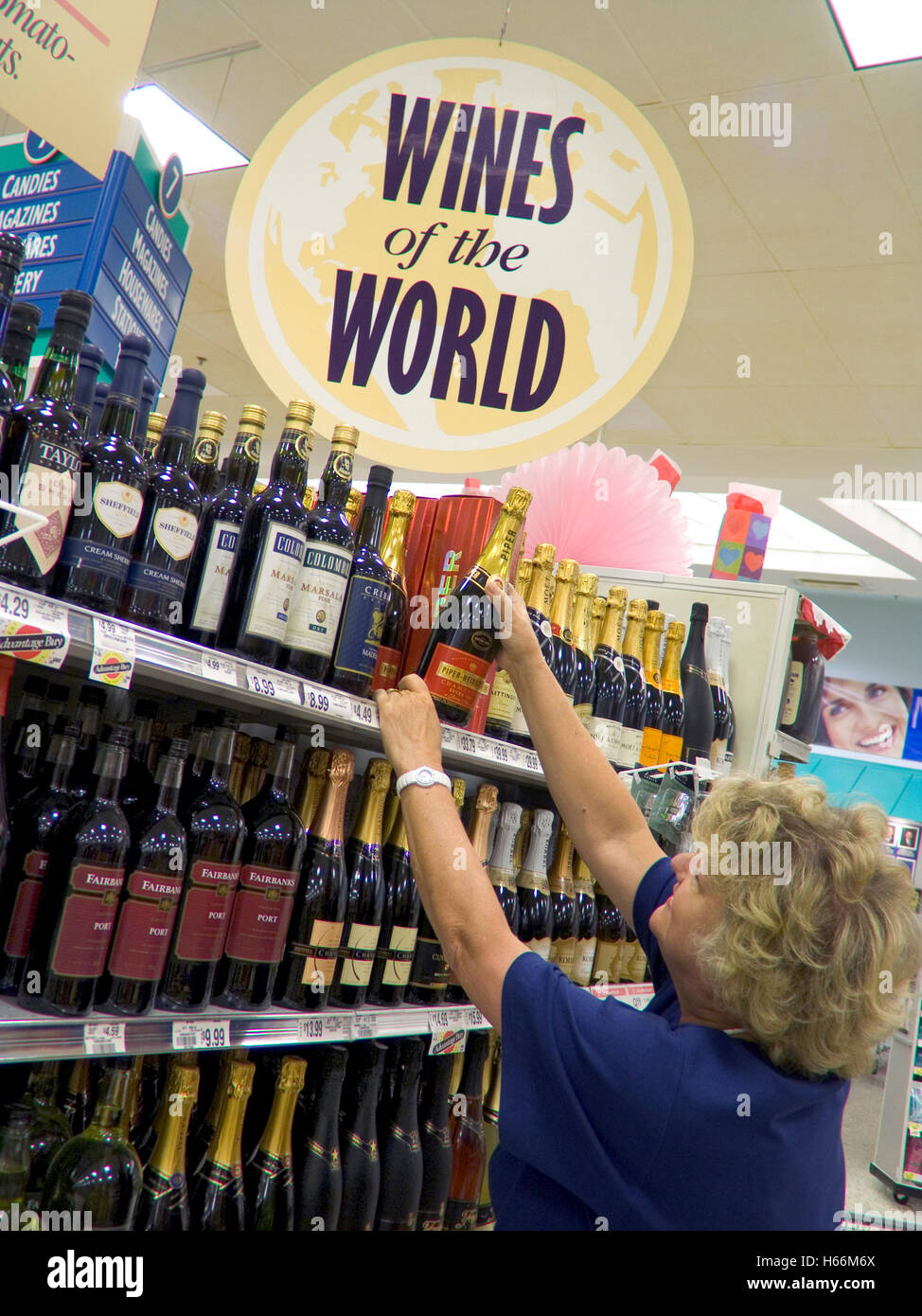 CHAMPAGNE WINE BUYING USA Supermarket wine aisle Woman browsing 'Wines