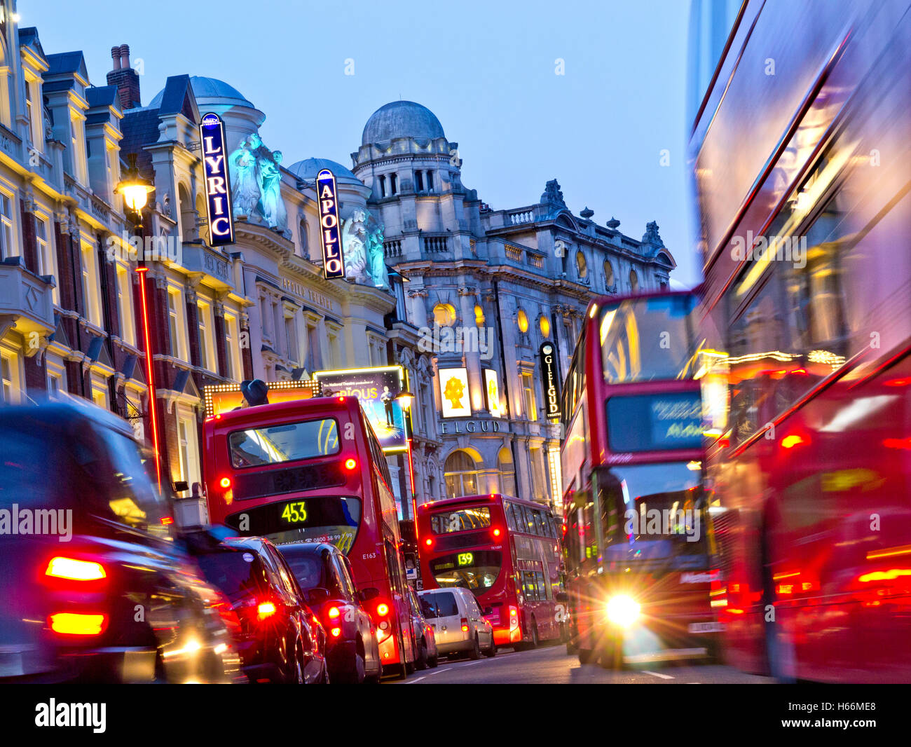 SHAFTESBURY AVENUE NIGHT LONDON TRAFFIC  Theatreland West End theatres busy heavy pollution diesel fumes gridlock with red buses  taxis and private vehicles in Shaftesbury Avenue at dusk West End London UK Stock Photo