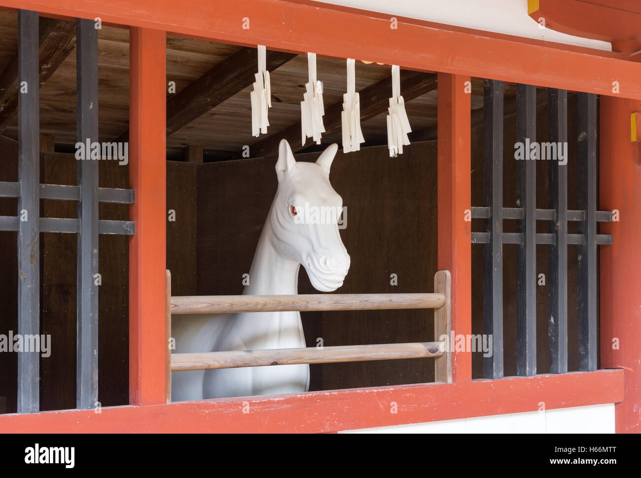 White stone statue of horse at itsukushima Shinto Shrine. Stock Photo