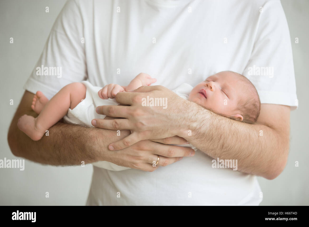 Man holding baby and arms and close up hires stock photography and images Alamy