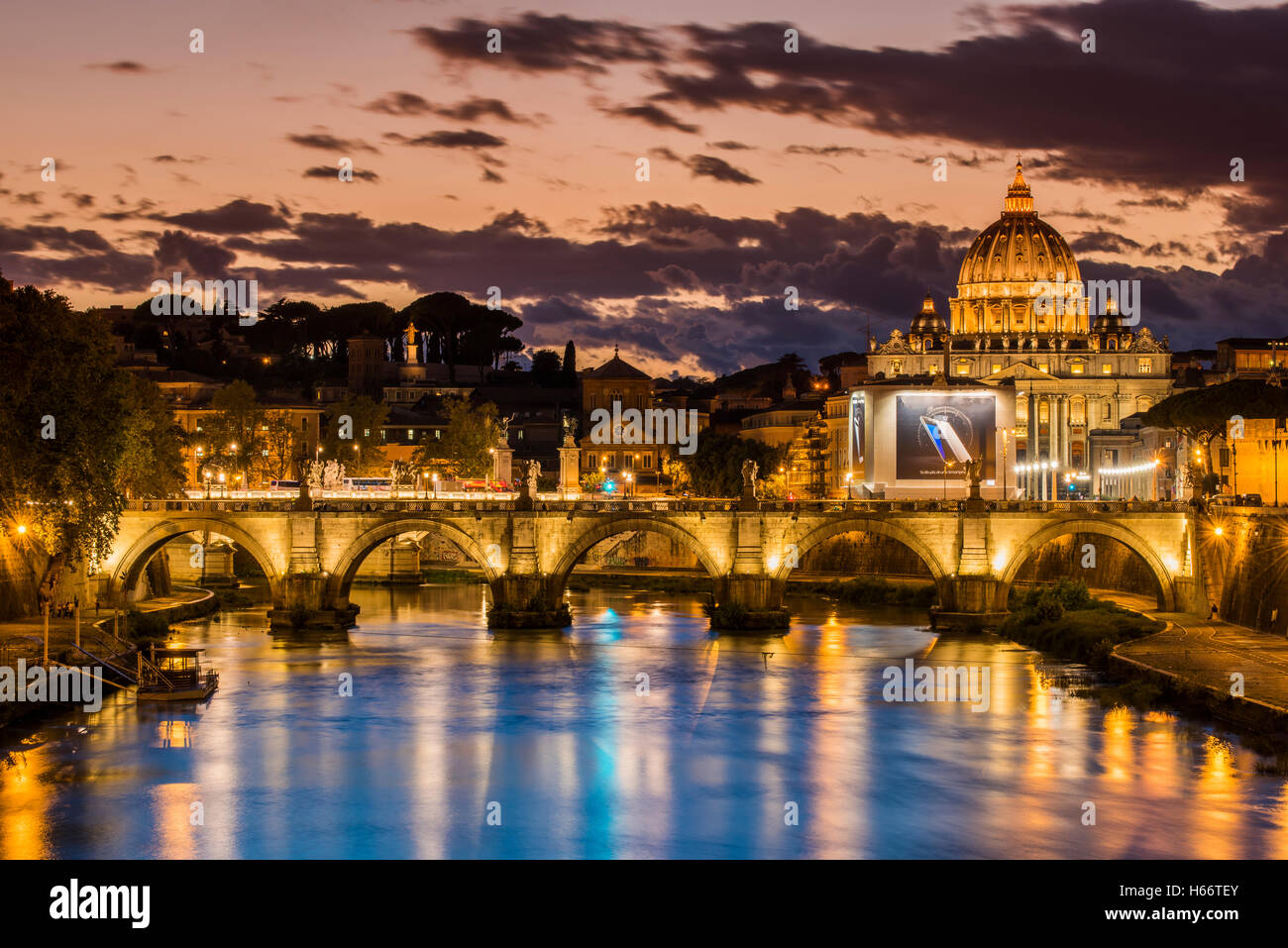 Twilight view of Tiber river with St. Peter's Basilica in the background, Rome, Lazio, Italy Stock Photo
