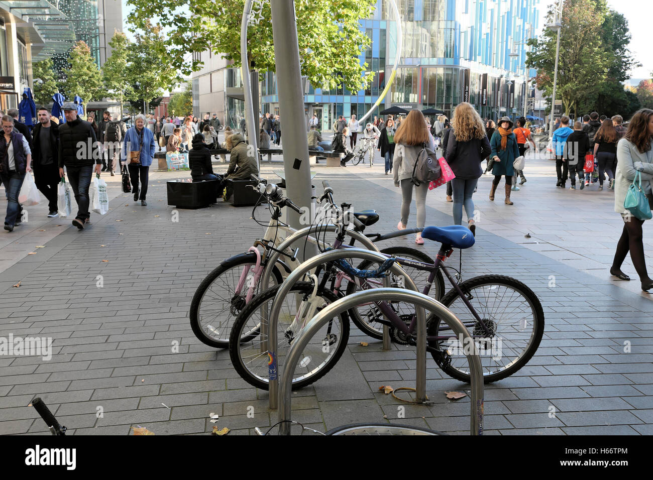 People walking and bicycles in Cardiff City Centre, Wales UK  KATHY DEWITT Stock Photo