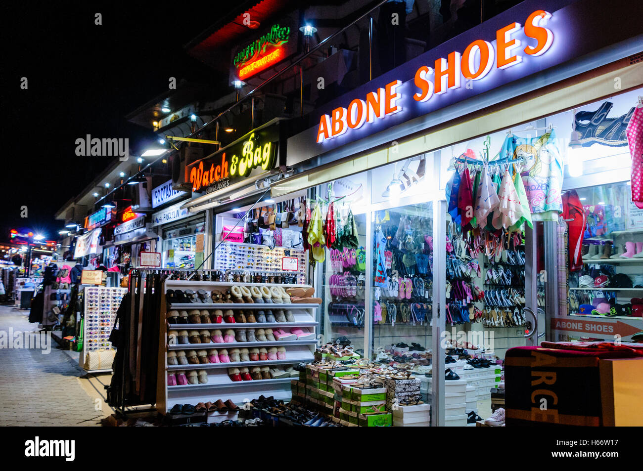 Row of shops in Turkey selling counterfeit clothing, sportswear, Ugg boots,  sunglasses and watches Stock Photo - Alamy