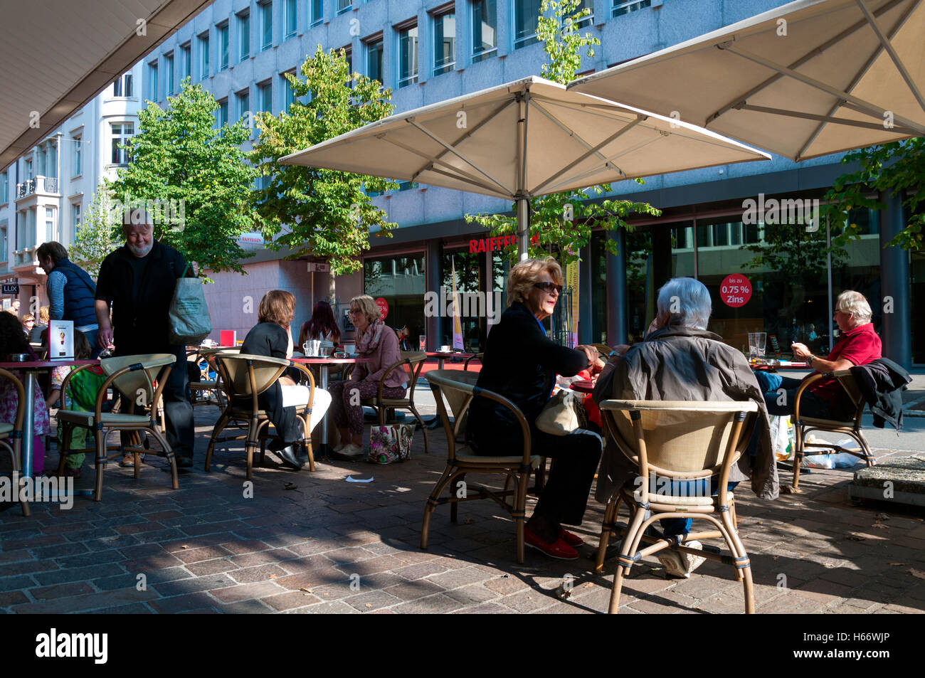 Customers sitting outside Gentile cafe bar in St. Gallen, Switzerland Stock Photo