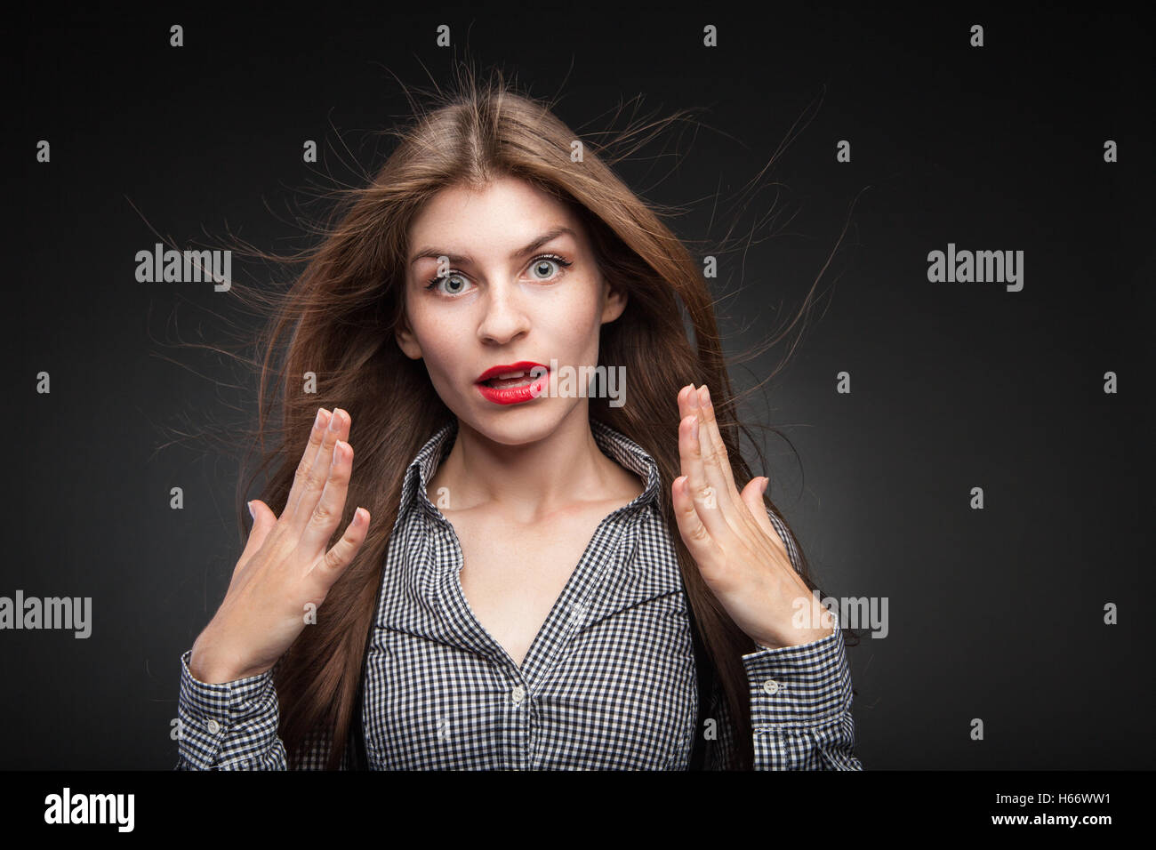Surprised girl with wide opened eyes. Stock Photo