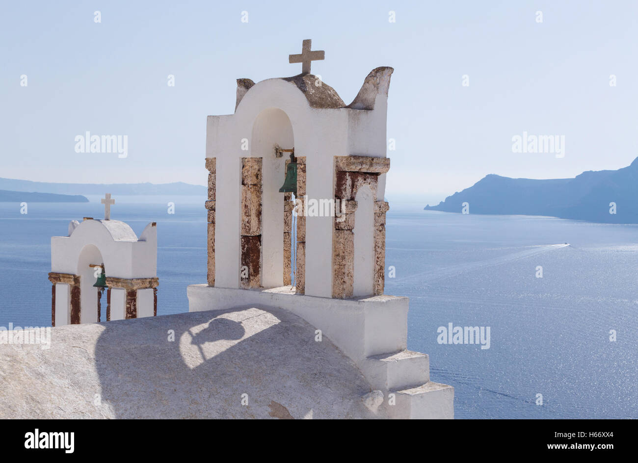 bell towers on church in Oia on Santorini Stock Photo