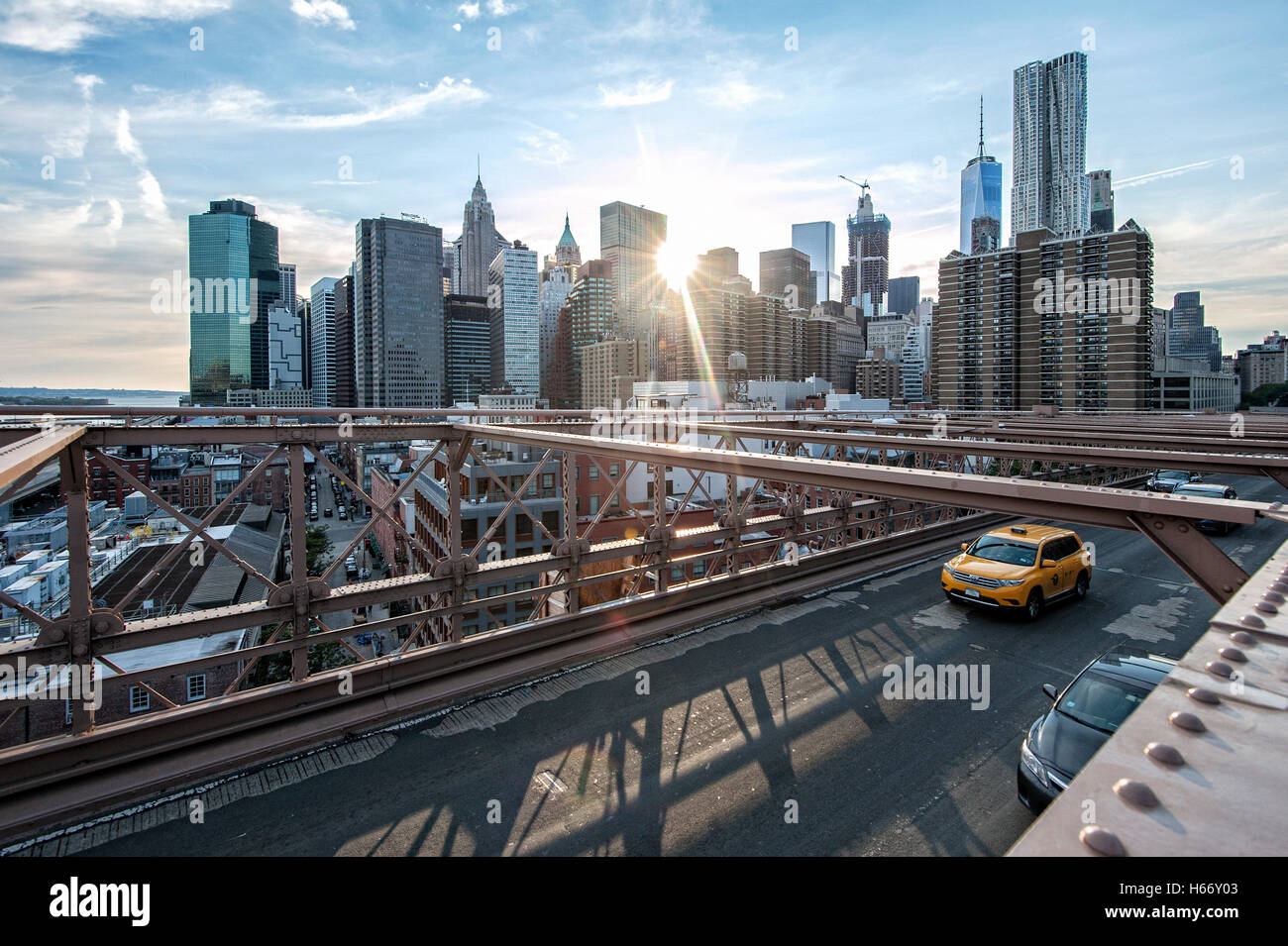 View of Lower Manhattan skyline at sunset from Brooklyn Bridge, East ...