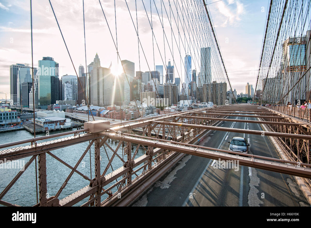 View of Lower Manhattan skyline at sunset from Brooklyn Bridge, East ...