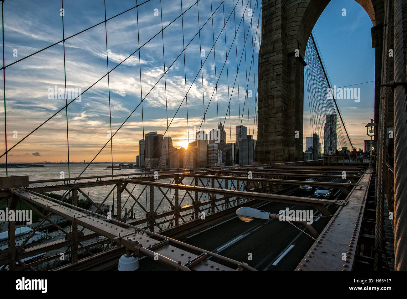 View of Lower Manhattan skyline at sunset from Brooklyn Bridge, East ...
