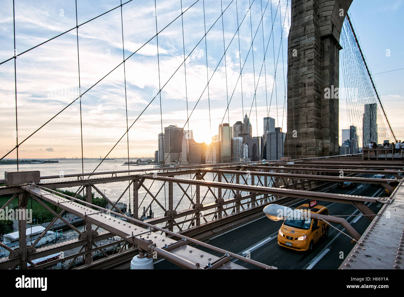 View of Lower Manhattan skyline at sunset from Brooklyn Bridge, East ...