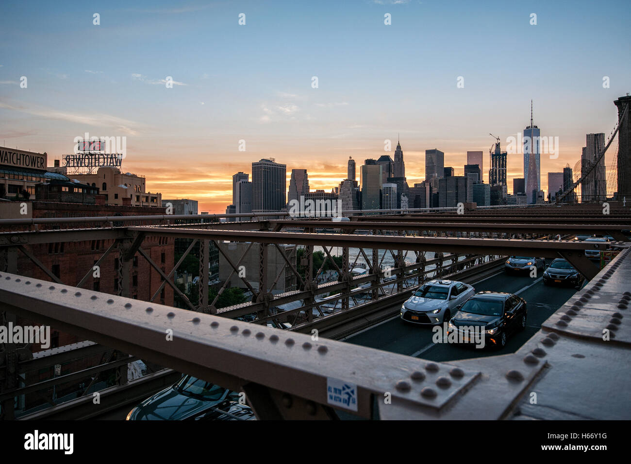 View of Lower Manhattan skyline at sunset from Brooklyn Bridge, East ...