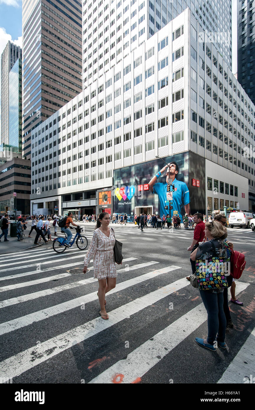 5th Avenue at W 53rd Street, skyscrapers, high rises, Uniqlo Shop, Novak  Djokovic advertisement, pedestrian crossing, Manhattan Stock Photo - Alamy