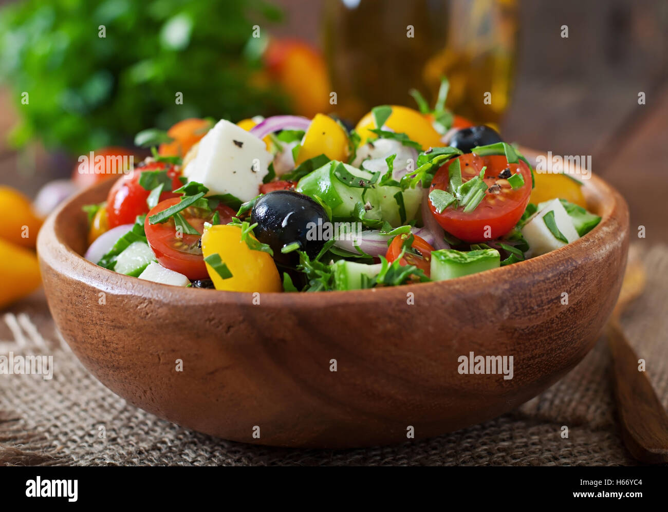 Greek salad with fresh vegetables, feta cheese and black olives. Stock Photo