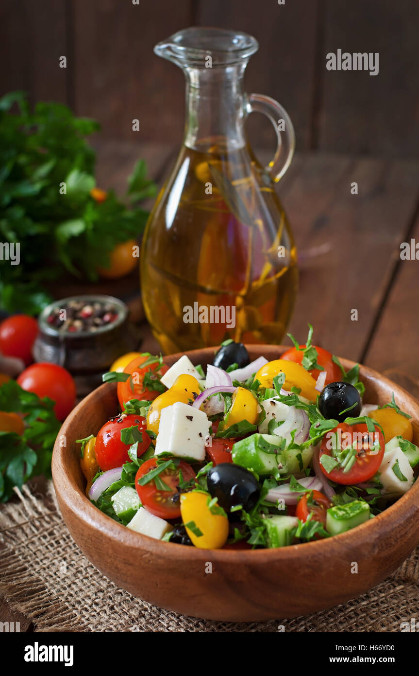 Greek salad with fresh vegetables, feta cheese and black olives. Stock Photo