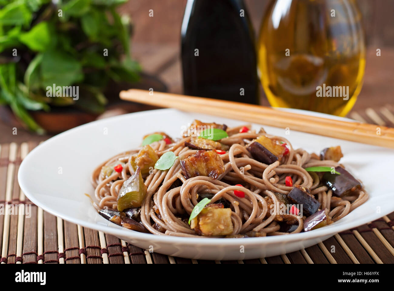 Soba noodles with eggplant in sweet and sour sauce Stock Photo Alamy