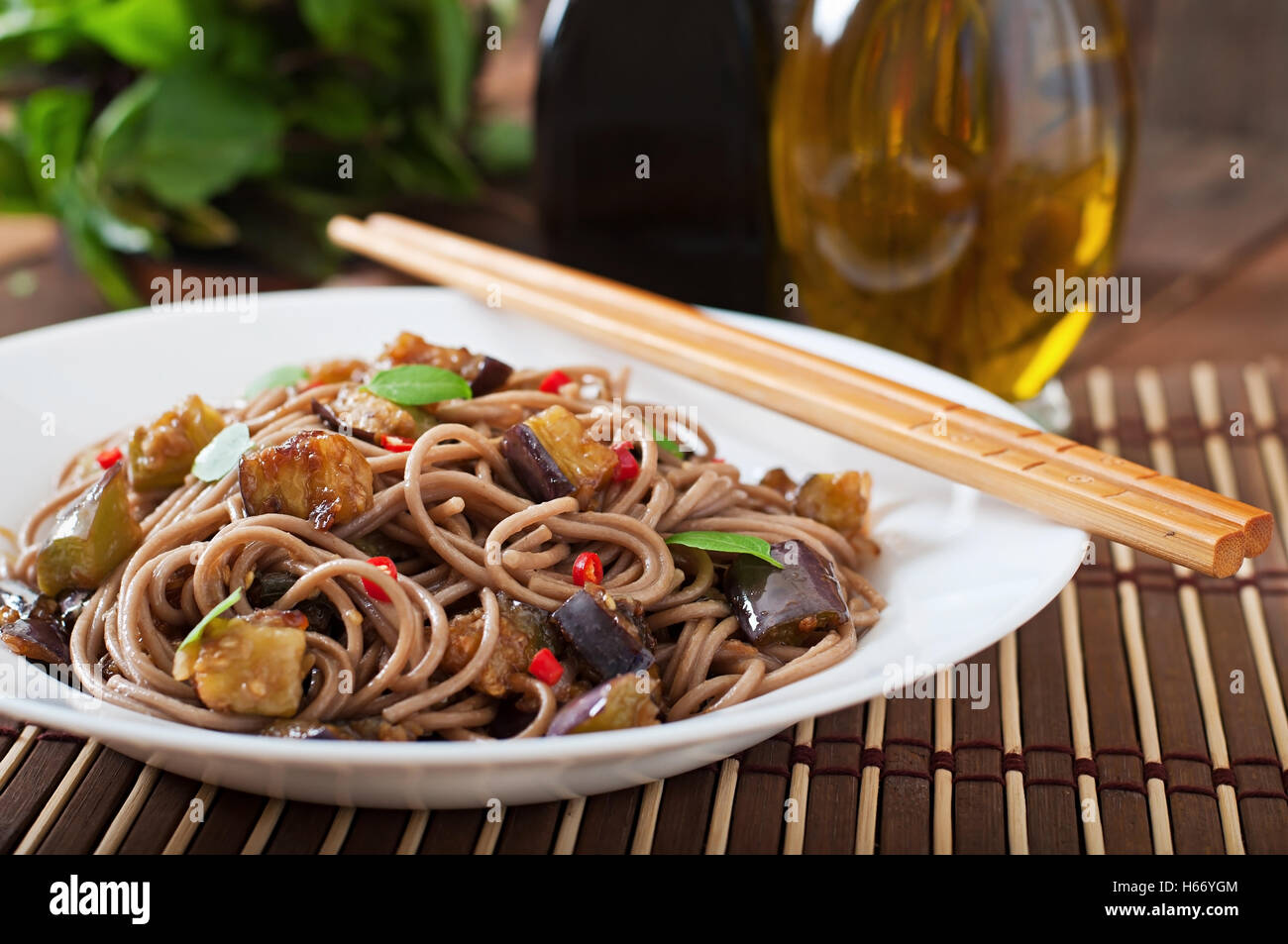 Soba noodles with eggplant in sweet and sour sauce Stock Photo Alamy