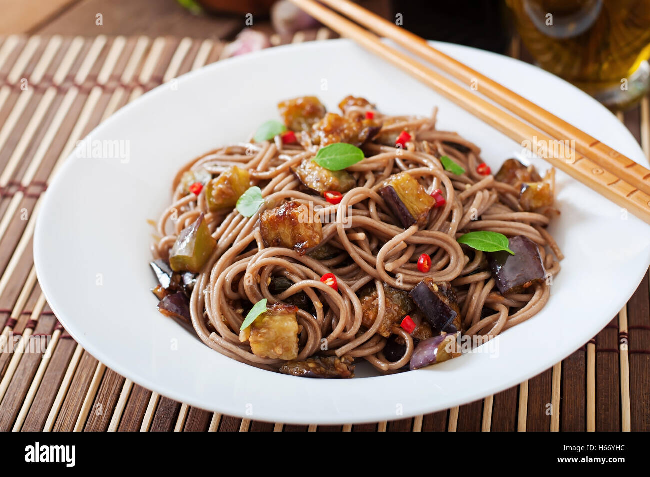 Soba noodles with eggplant in sweet and sour sauce Stock Photo Alamy