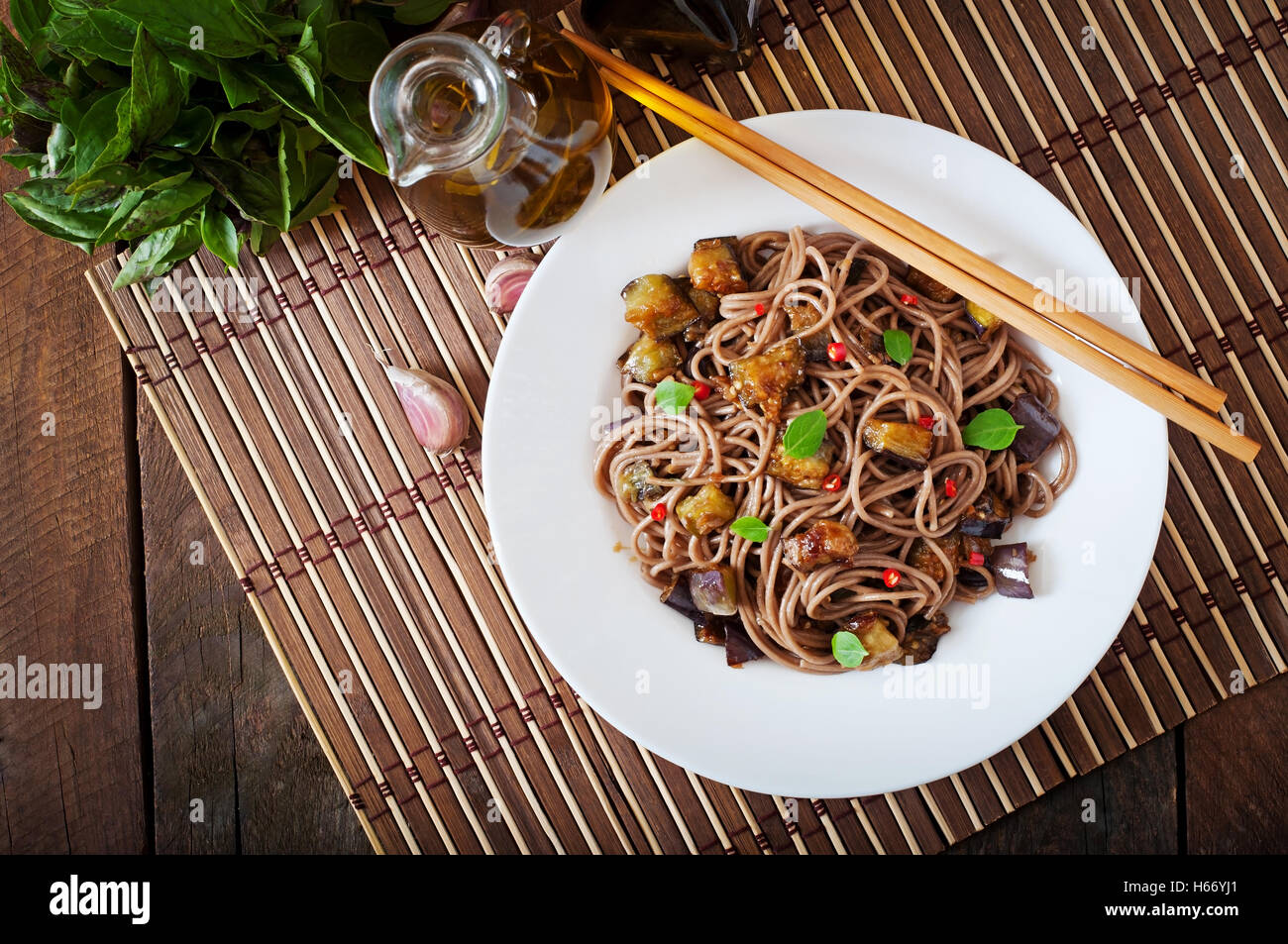 Soba noodles with eggplant in sweet and sour sauce. Top view Stock