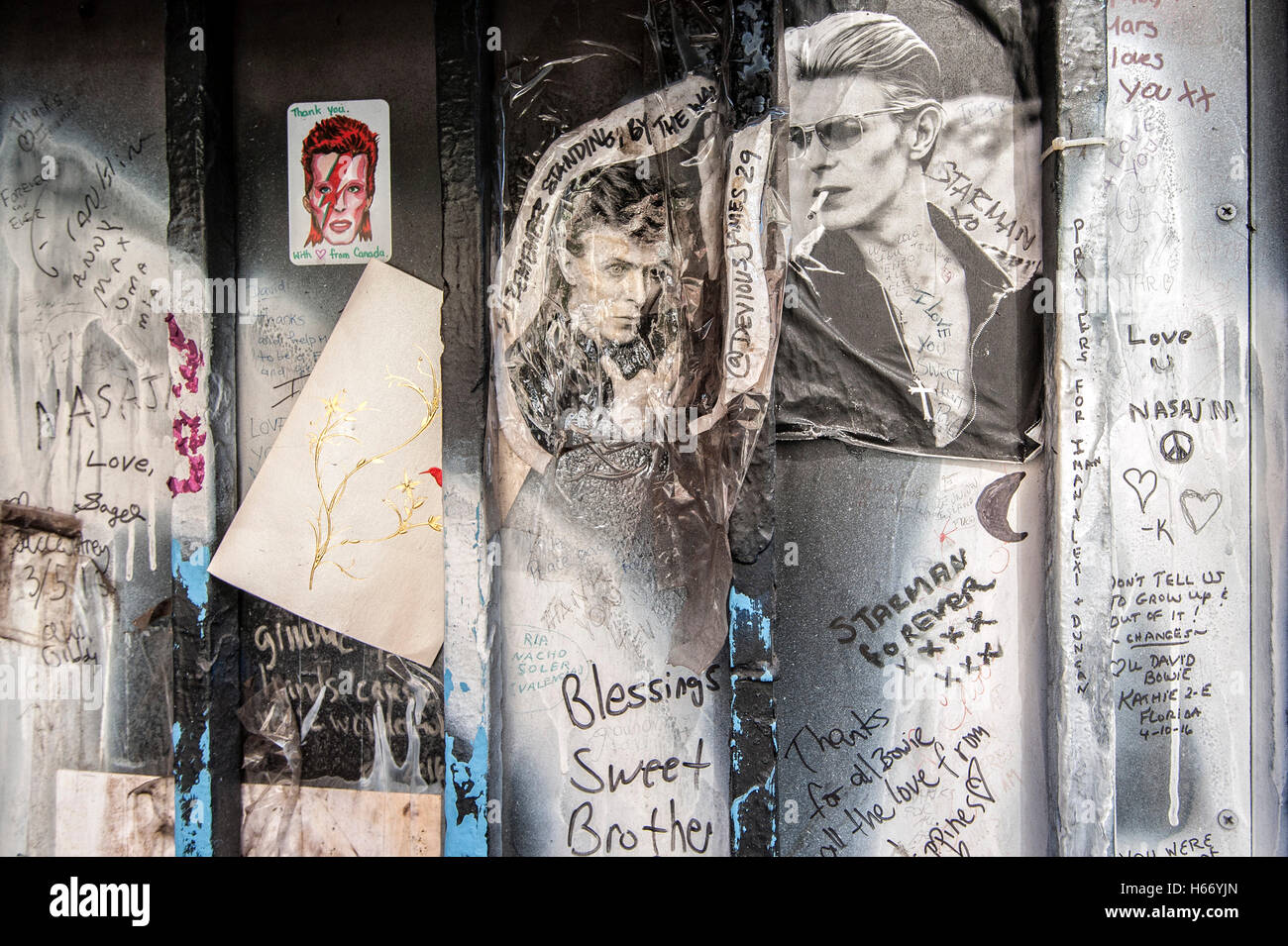 Fan memorial to musician David Bowie next to his apartment building on Lafayette Street, SoHo