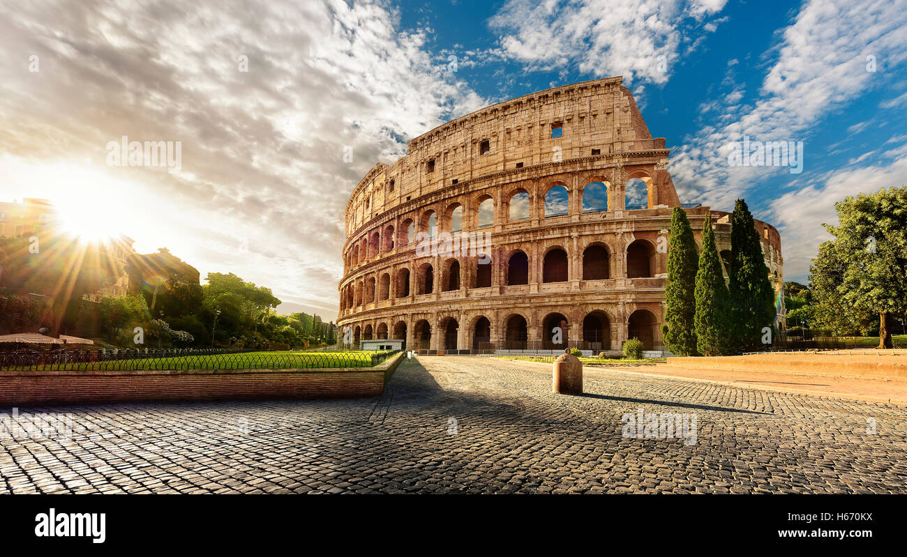 Colosseum in Rome and morning sun, Italy Stock Photo