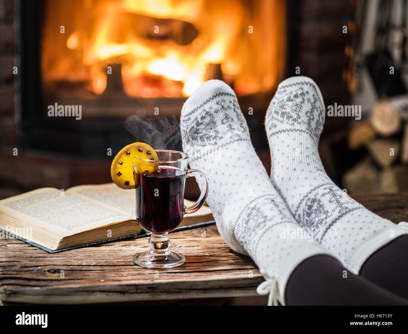 feet warming up on fireplace - a Royalty Free Stock Photo from