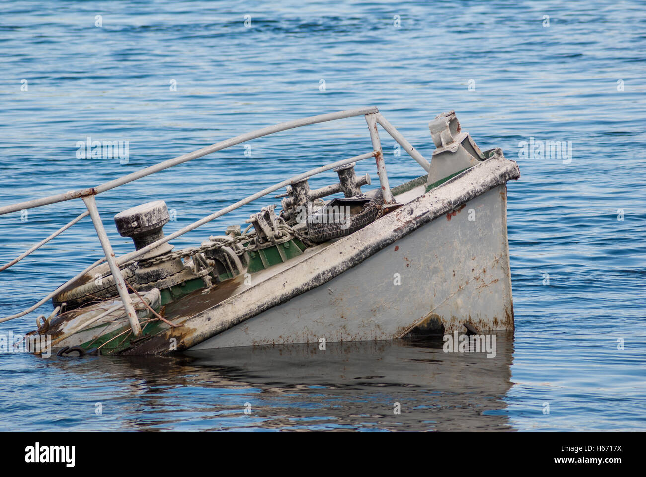 Rusty ship wreck in a blue river Stock Photo