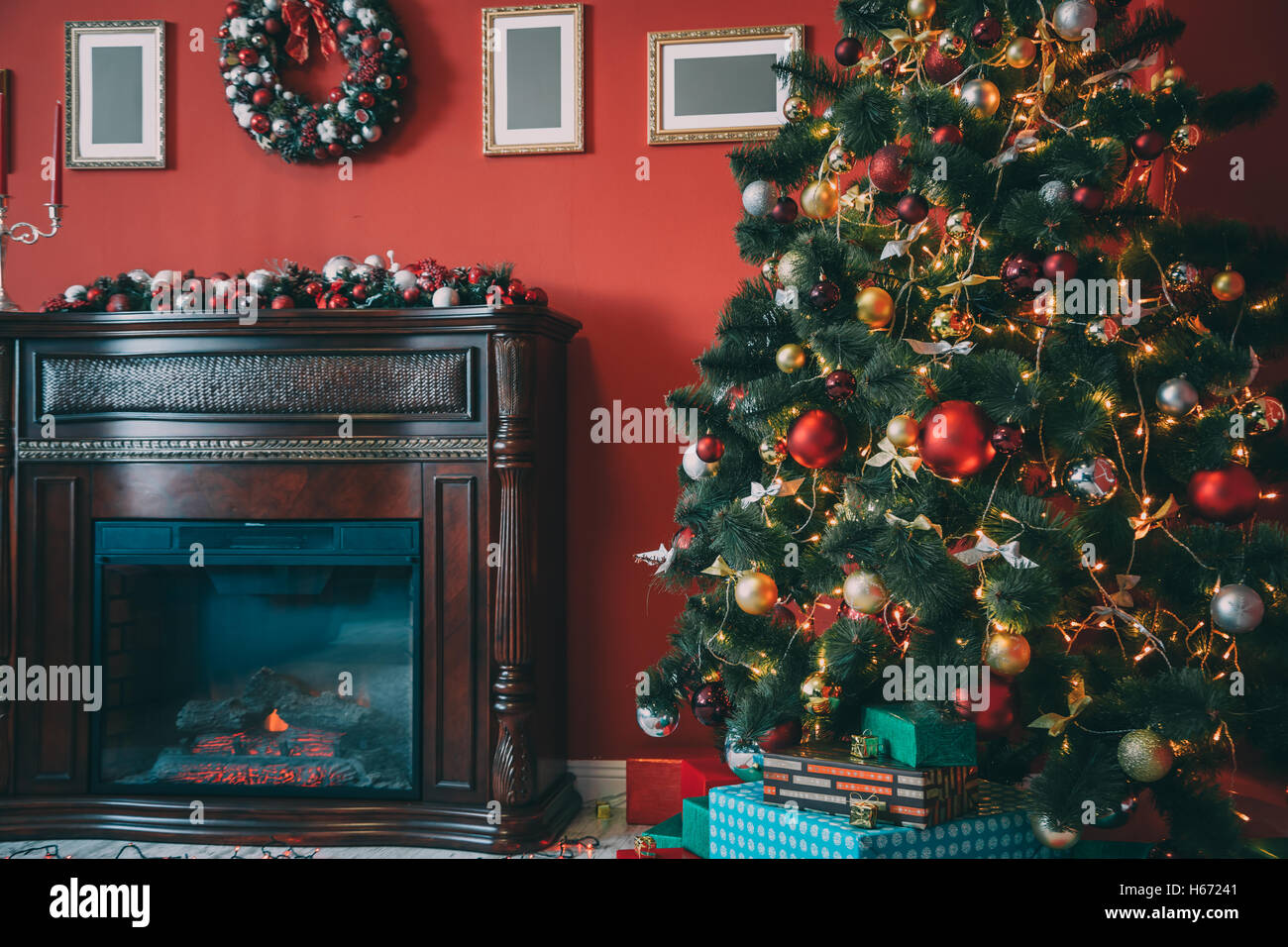 Beautiful new year room with decorated Christmas tree, gifts and fireplace. The idea for postcards. Soft focus. Shallow DOF Stock Photo