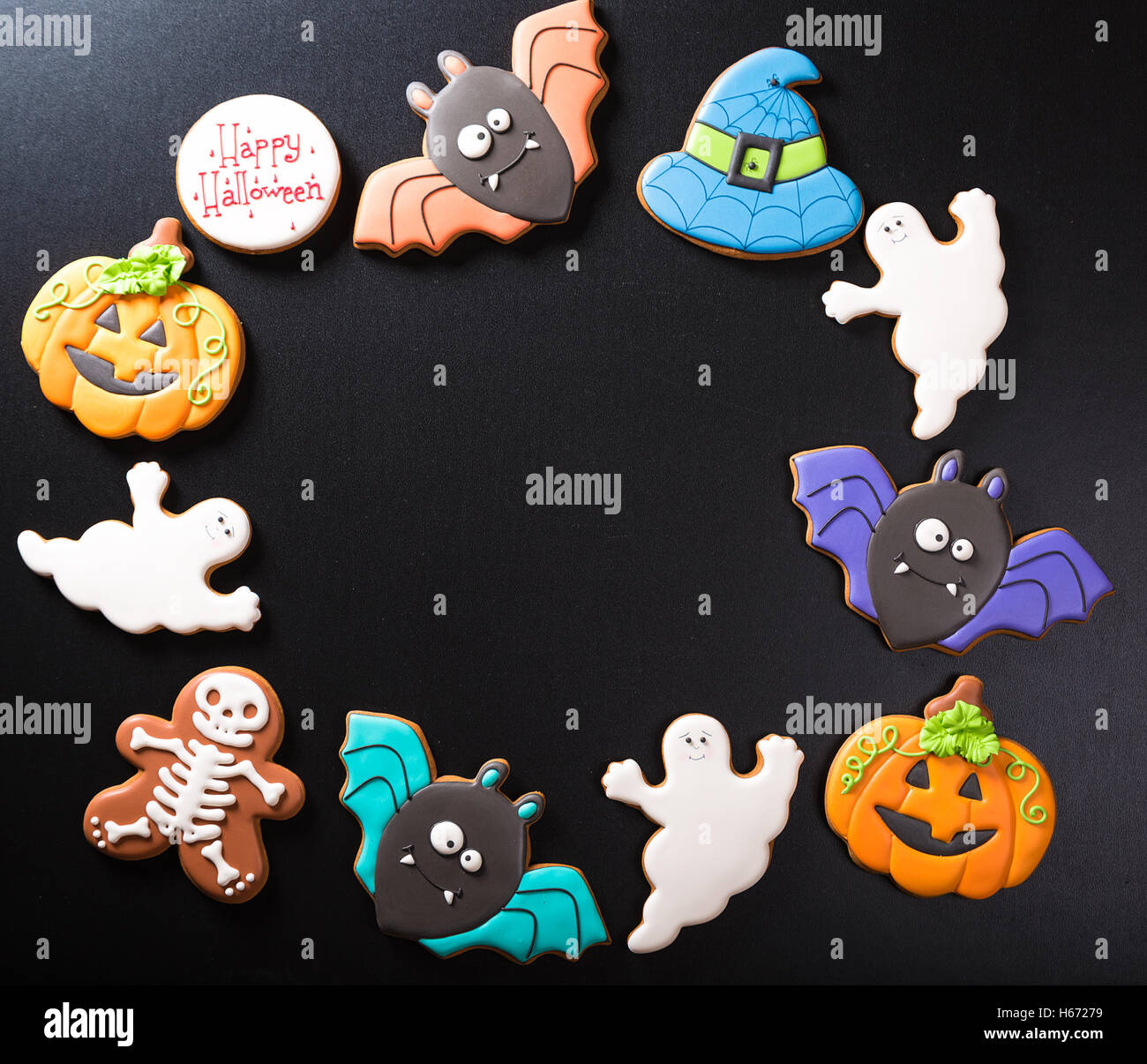 Funny delicious ginger biscuits for Halloween on the dark background. Stock Photo