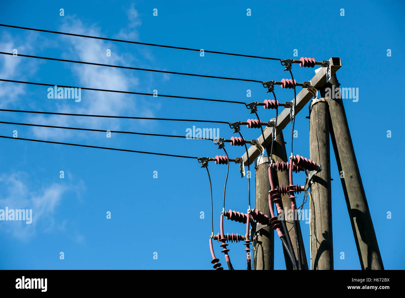 Electric cable pole providing electric needs. Stock Photo