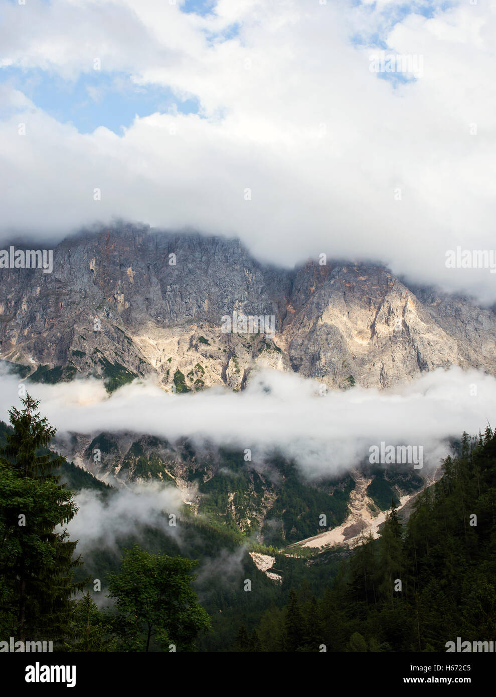 mystic mountain scene surrounded with fog. Stock Photo