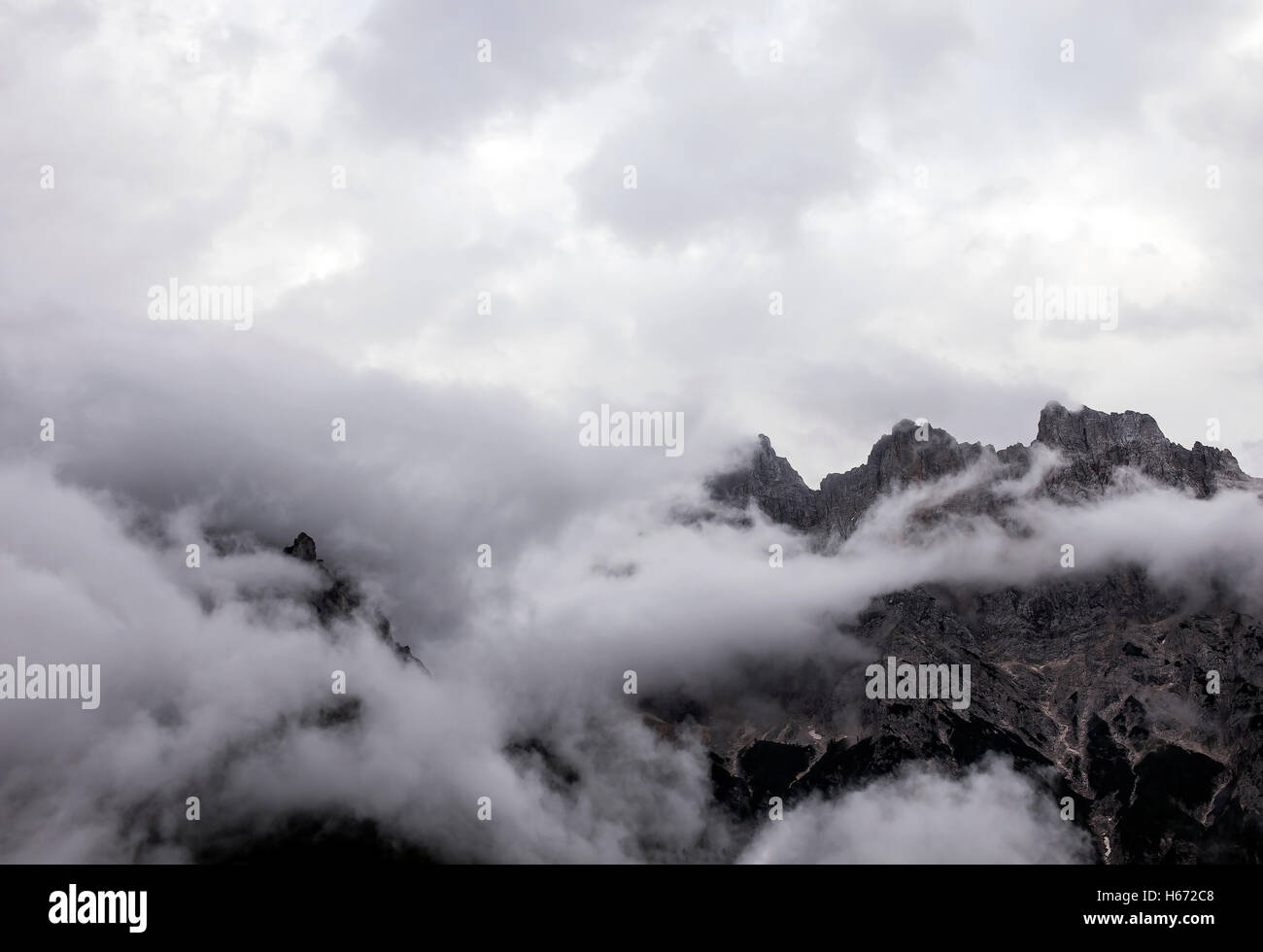 Mystic mountain scene surrounded with fog. Stock Photo