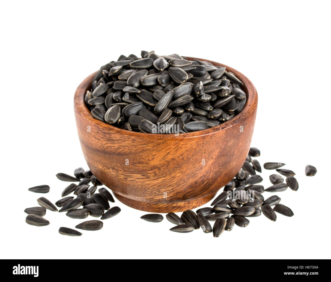 Black sunflower seeds in bowl isolated on white Stock Photo Alamy