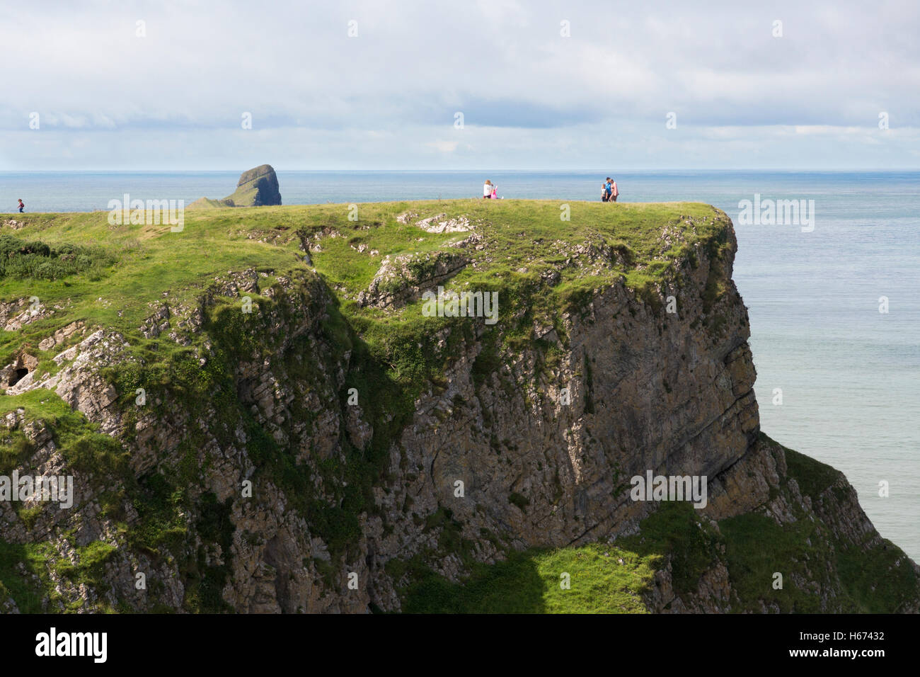 Sightseers on cliffs at Rhossili Bay, the Gower Peninsula Stock Photo