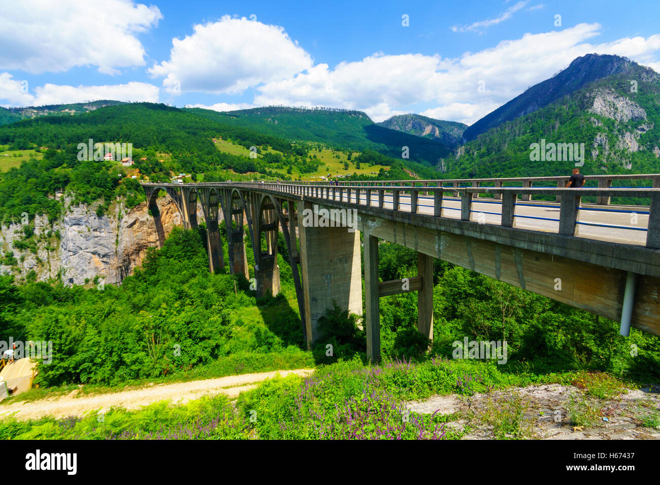 BUDECEVICA, MONTENEGRO - JULY 02, 2015: Scene of the Durdevica Tara Bridge, across the Tara River Canyon, with locals and touris Stock Photo