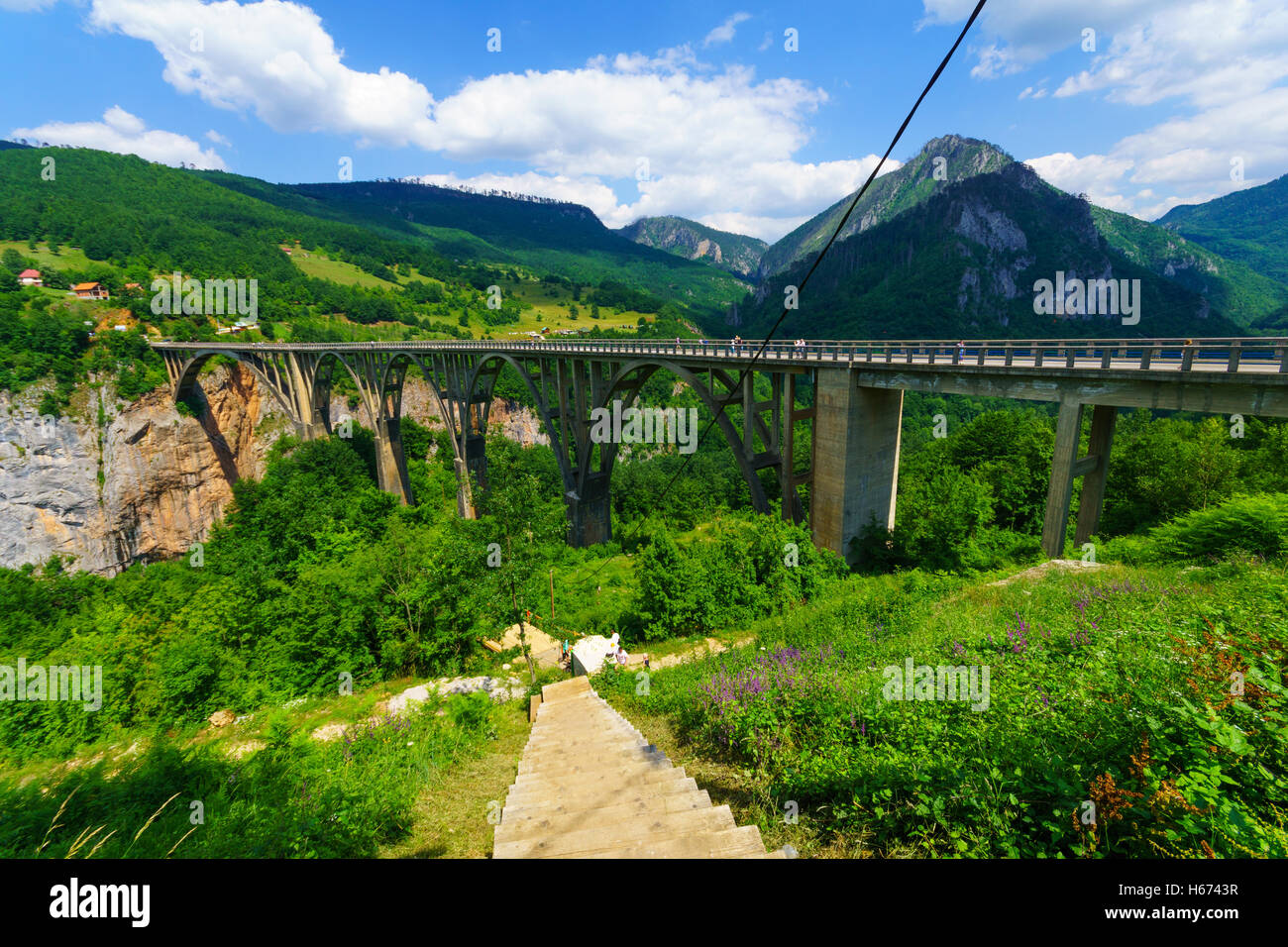 BUDECEVICA, MONTENEGRO - JULY 02, 2015: Scene of the Durdevica Tara Bridge, across the Tara River Canyon, with locals and touris Stock Photo