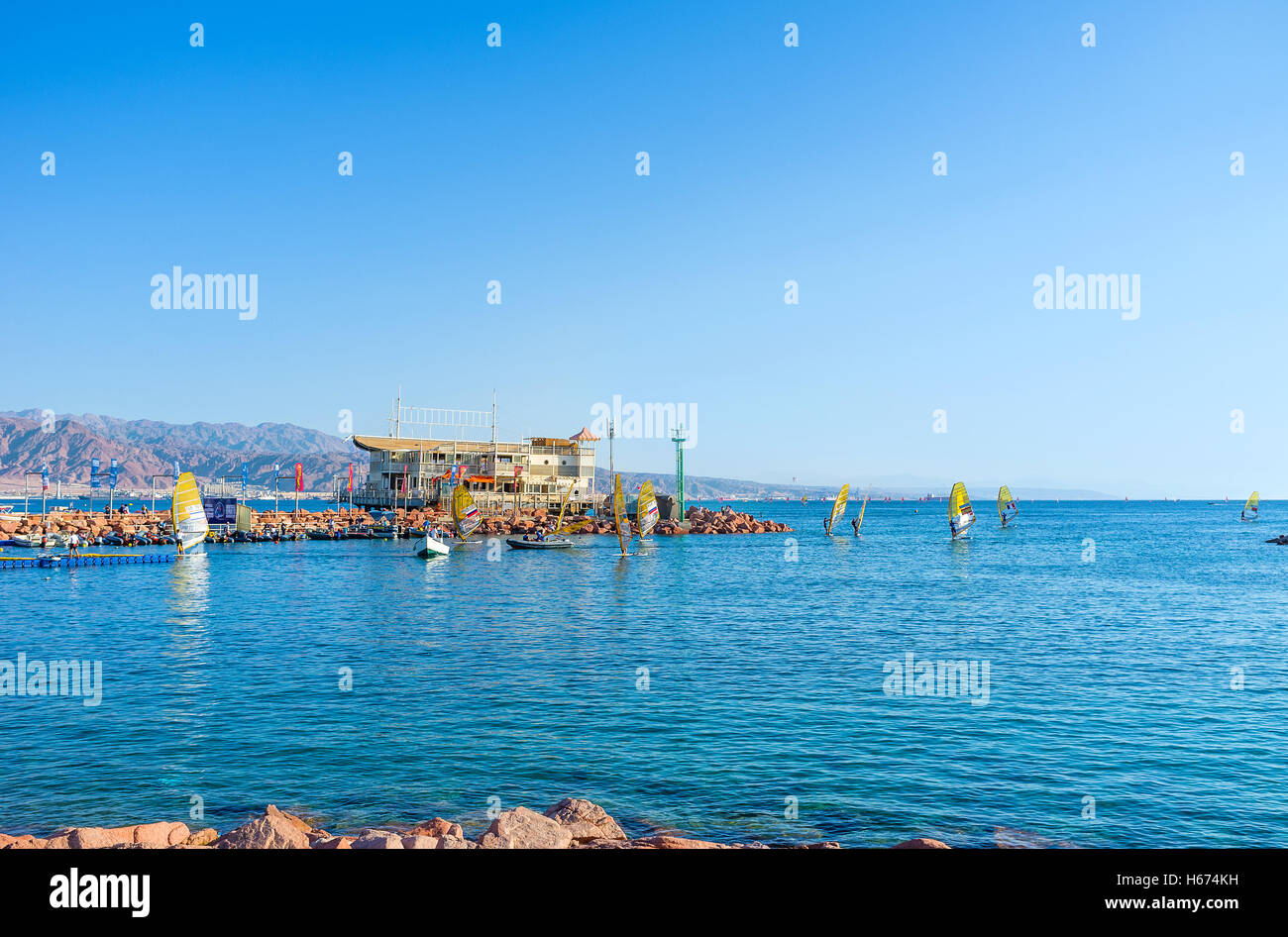The windsurfers back to the harbor after the competitions,  Eilat. Stock Photo