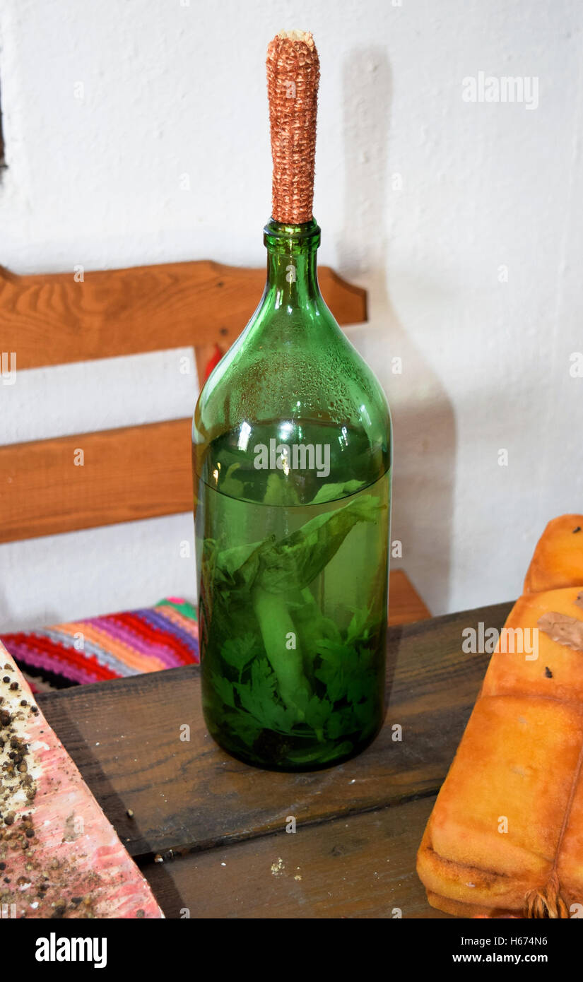 Tincture of horseradish and parsley on moonshine. A bottle of liqueur
