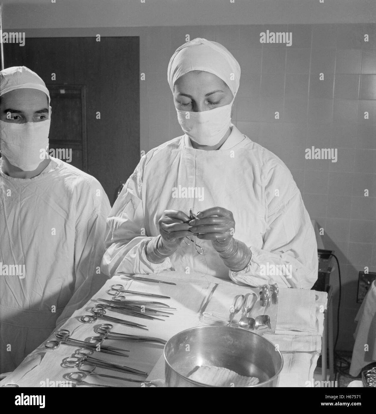 Nurse Threading Needle during Surgery, Fritz Henle for Office of War Information, November 1942 Stock Photo
