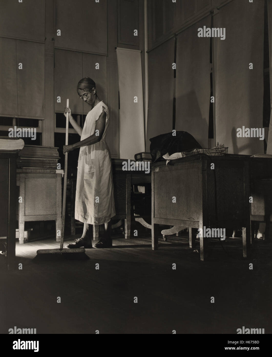 Government Charwoman Cleaning Office after Regular Working Hours, Washington DC, USA, Gordon Parks for Office of War Information, August 1942 Stock Photo