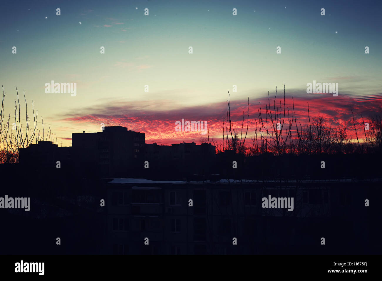 red sunset sky silhouettes of buildings Stock Photo - Alamy