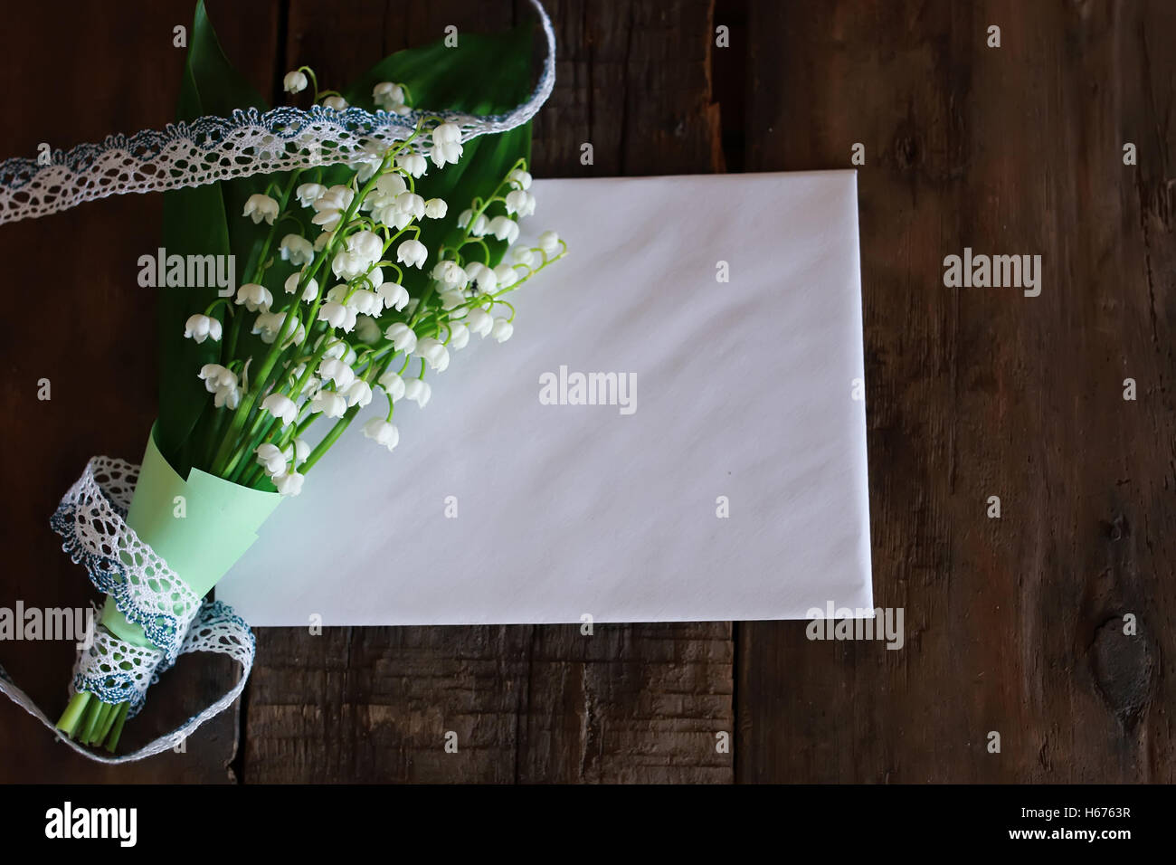 bouquet of lilies of the valley and space text Stock Photo - Alamy