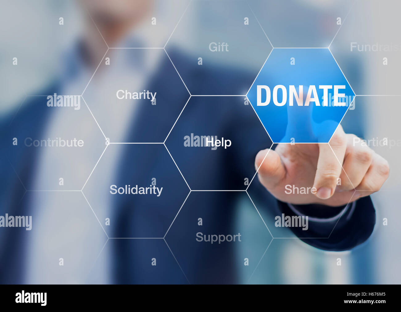 Donate button with words about helping, supporting and contributing and a person in background Stock Photo