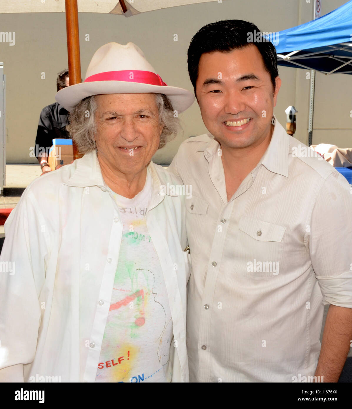 Stephen Kalinich and David Ryu attends the 25th Annual Sherman Oaks Street Fair Featuring The Stray Cats' Lee Rocker in Sherman Oaks, California on October 18, 2015 Stock Photo