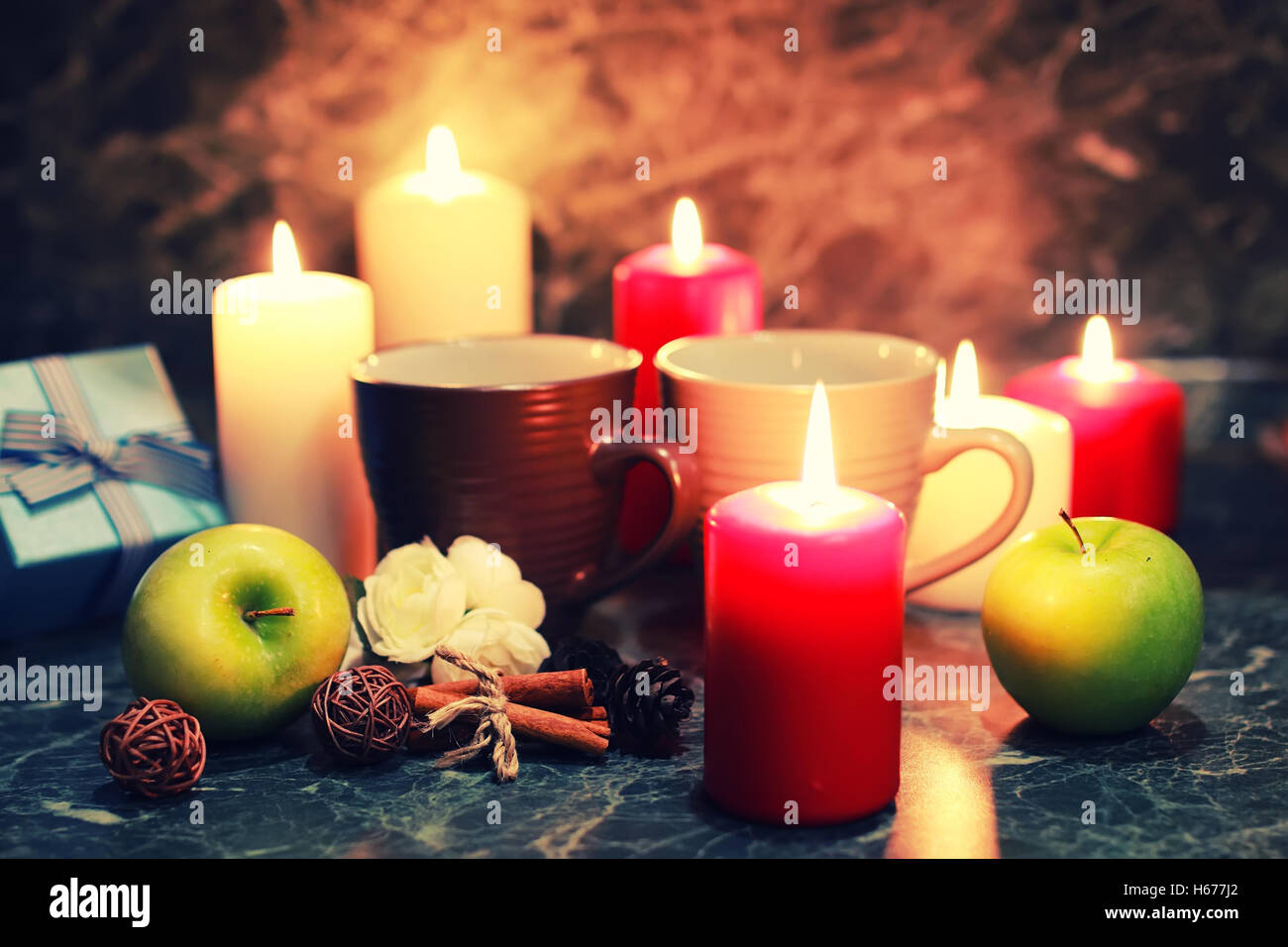 night table with mug and candle Stock Photo - Alamy