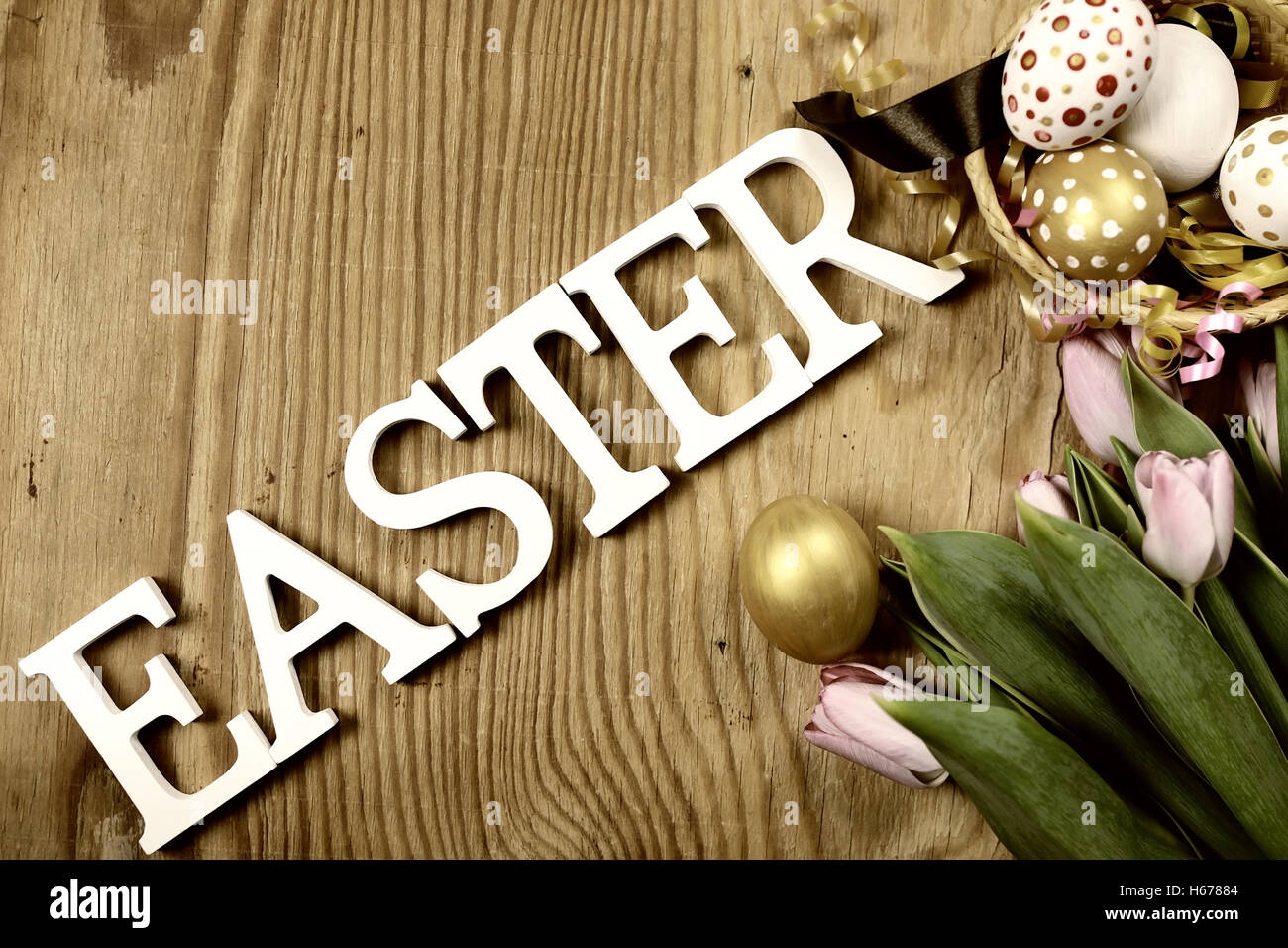 Toned background easter tulips and eggs Stock Photo - Alamy